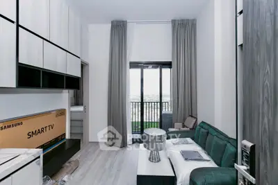 Modern living room with balcony view and stylish furniture in a contemporary apartment.