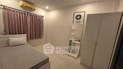 Cozy bedroom with air conditioning and modern furnishings