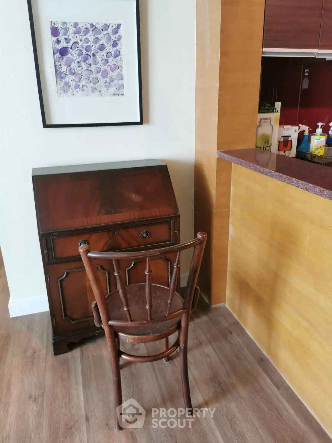 Charming interior corner with vintage wooden desk and chair, perfect for a cozy home office setup.