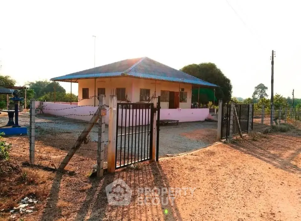 Charming rural house with spacious yard and secure gated entrance, perfect for serene countryside living.