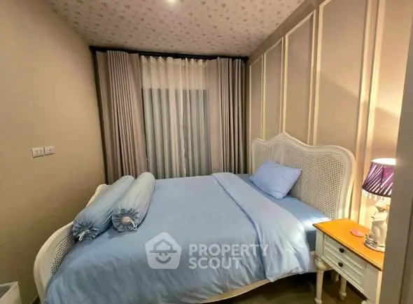 Cozy bedroom with elegant decor and soft lighting, perfect for relaxation.