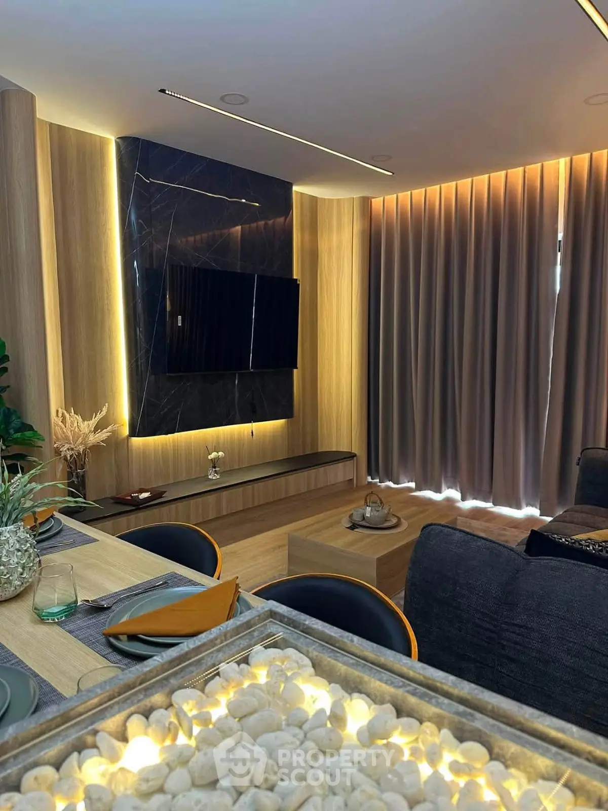 Modern living room with stylish decor and ambient lighting