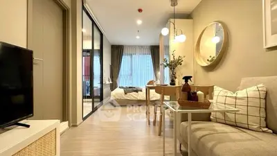 Modern studio apartment with open layout, cozy living area, and stylish decor.