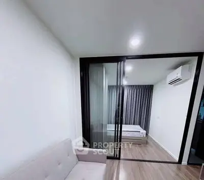 Modern apartment with sliding glass doors and cozy bedroom