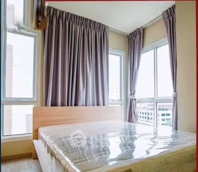 Bright corner bedroom with large windows and modern design