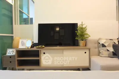 Modern living room with stylish TV stand and cozy decor