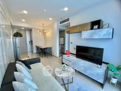 Modern living room with sleek furniture and stylish decor in a contemporary apartment.