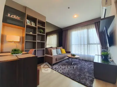 Modern living room with cozy sofa, stylish shelving, and large window with natural light.