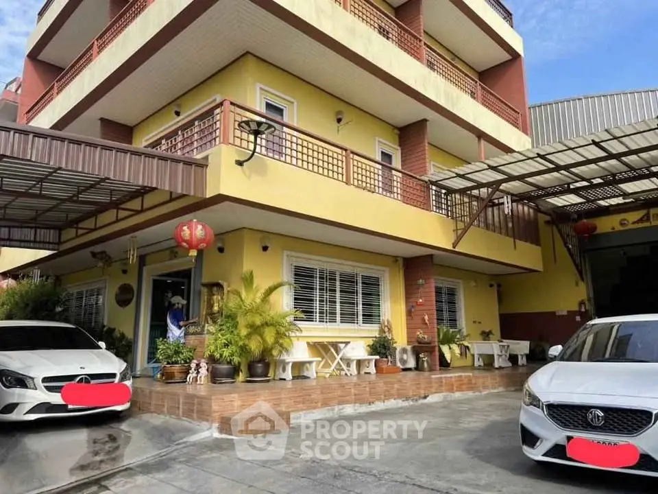 Charming multi-story building with spacious balconies and ample parking space.