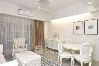 Elegant living room with classic white furniture and stylish decor