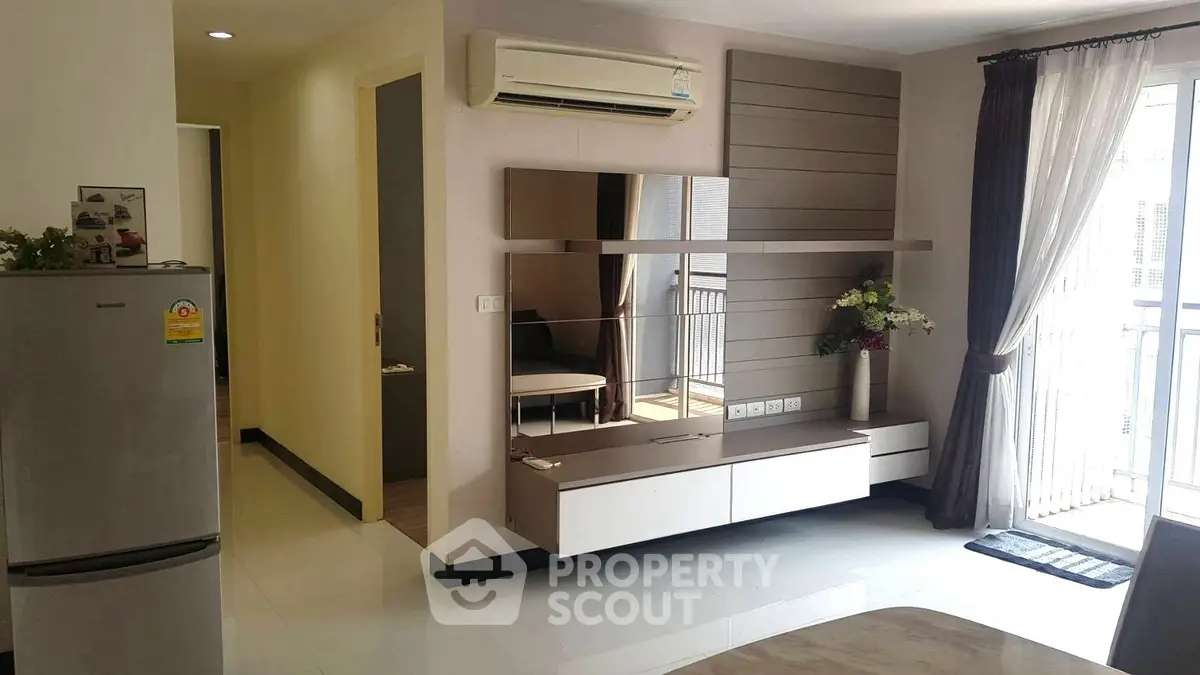 Modern living room with air conditioning and balcony access