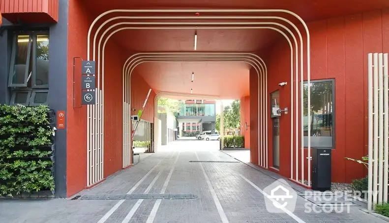 Modern building entrance with unique architectural design and vibrant colors