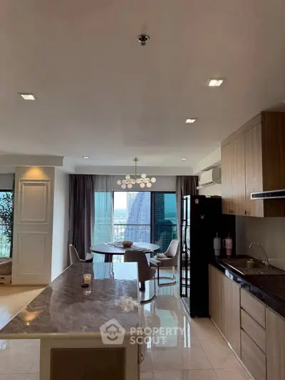 Luxurious open-plan kitchen and dining area with city view, modern fixtures, and elegant marble countertop.