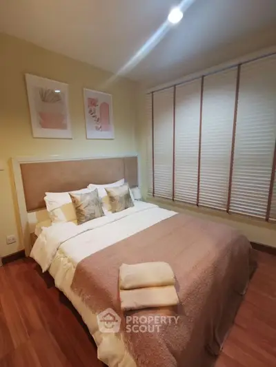 Cozy bedroom with stylish decor and warm lighting