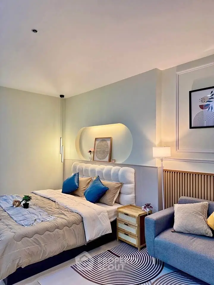 Luxurious bedroom with modern decor and cozy seating area