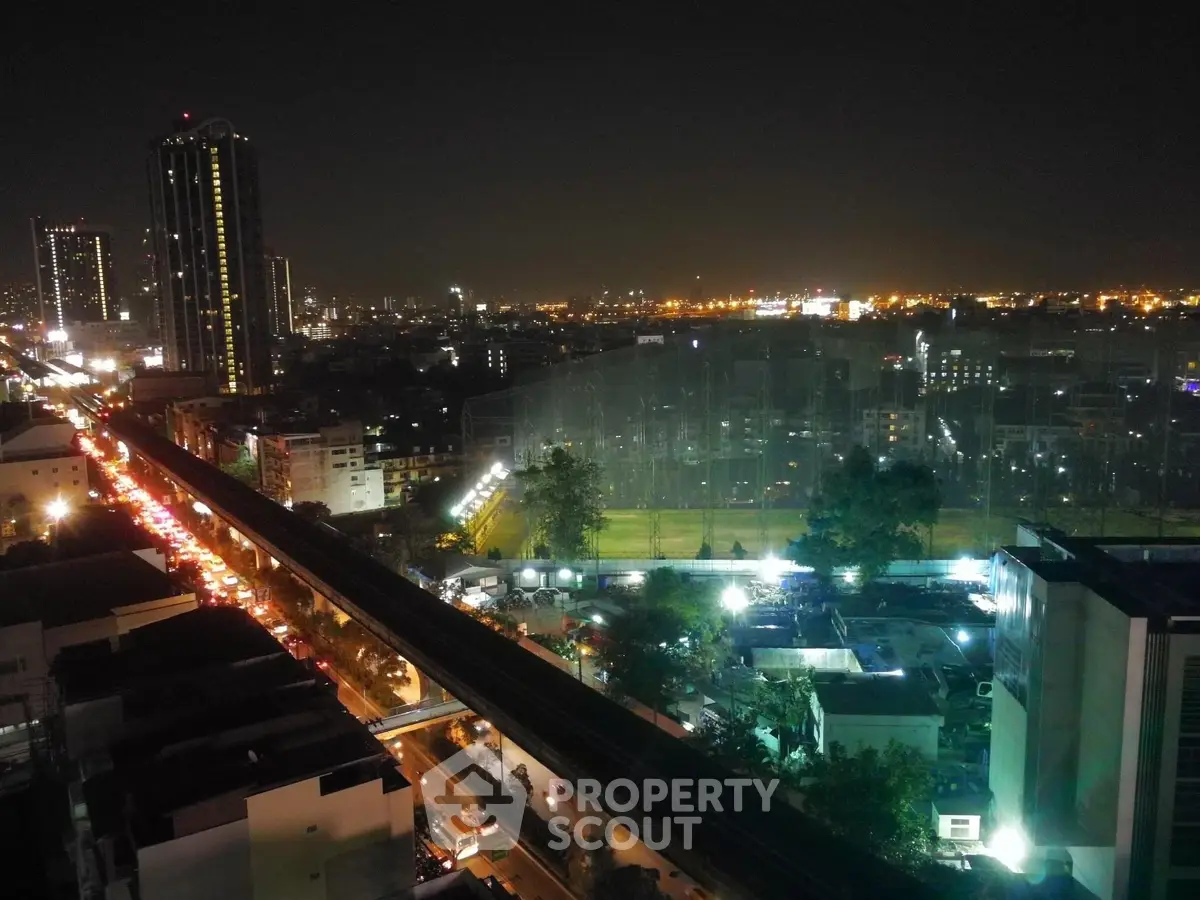 Stunning cityscape night view with illuminated skyline and bustling streets.