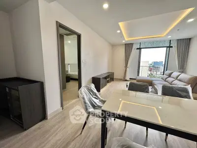 Modern living room with open layout and city view balcony