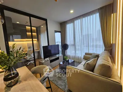 Modern living room with stylish decor and large windows offering city views