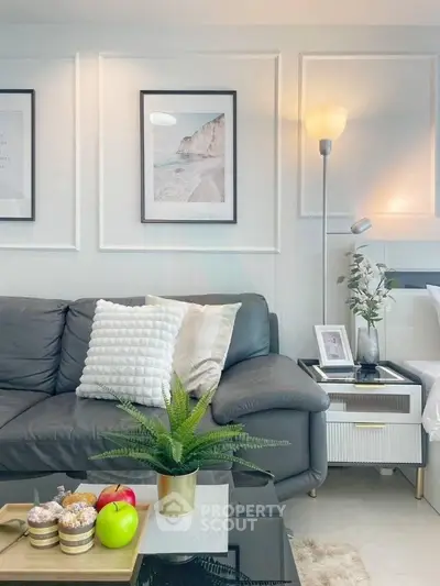 Stylish living room with modern decor, cozy sofa, and elegant lighting in a chic apartment.