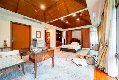 Luxurious bedroom with wooden ceiling and elegant decor