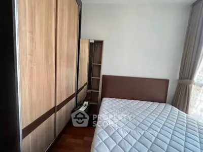 Cozy bedroom with modern wardrobe and natural light