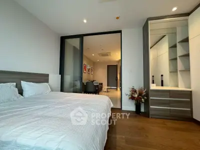 Modern bedroom with elegant decor and spacious layout in a luxury apartment.