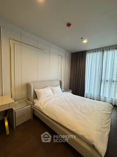 Modern bedroom with elegant decor and natural light