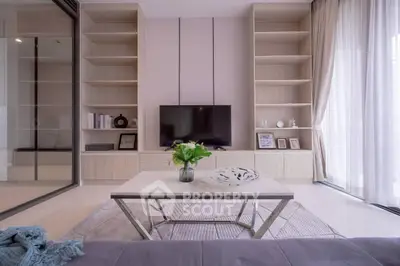 Modern living room with sleek TV unit and elegant decor