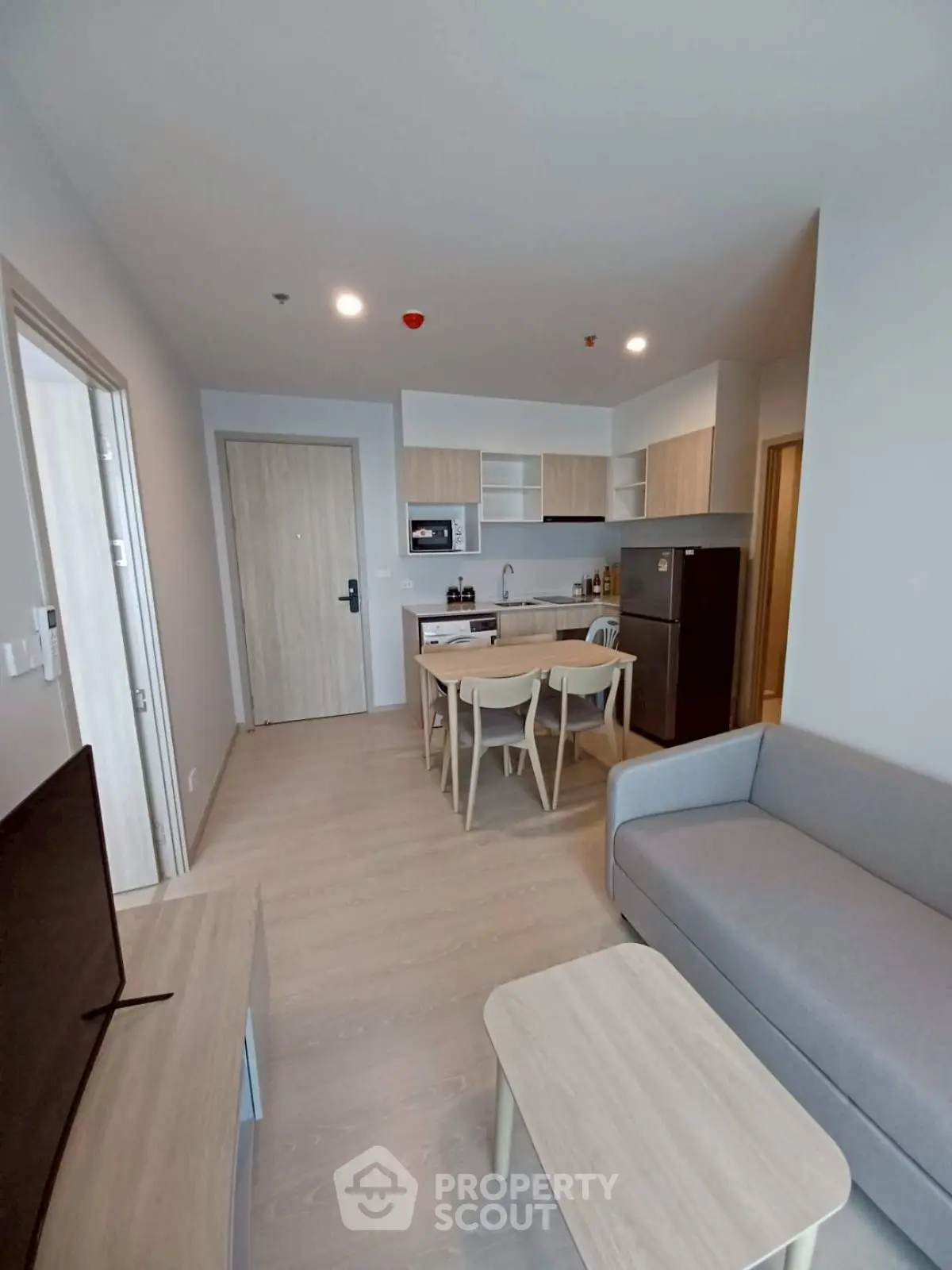 Modern open-plan living room with kitchen in stylish apartment