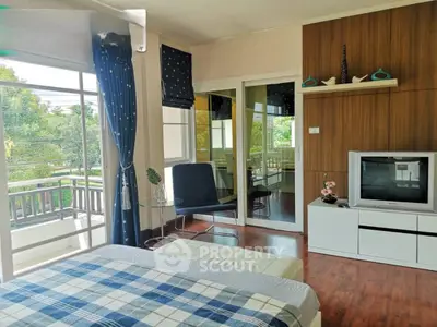 Bright bedroom with balcony access and modern decor