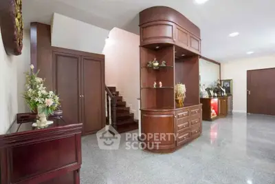Spacious interior with elegant wooden cabinetry and polished flooring, ideal for stylish living.