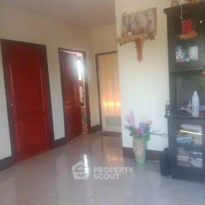 Cozy living room with polished floors and decorative elements