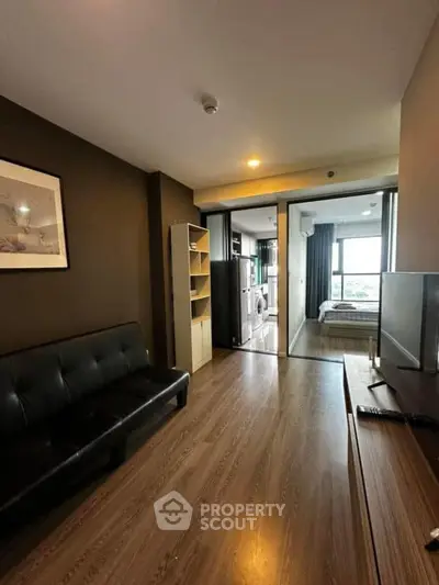 Modern apartment interior with sleek living room and bedroom view