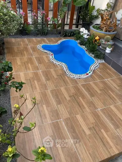 Charming garden with a small decorative pool and vibrant plants