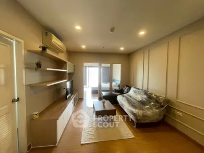 Modern living room with stylish furniture and natural light, perfect for cozy gatherings.