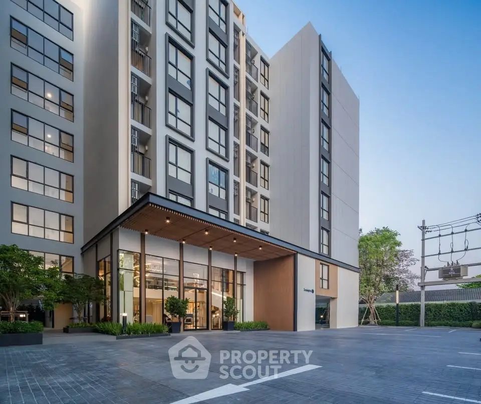 Modern apartment building with sleek design and spacious entrance