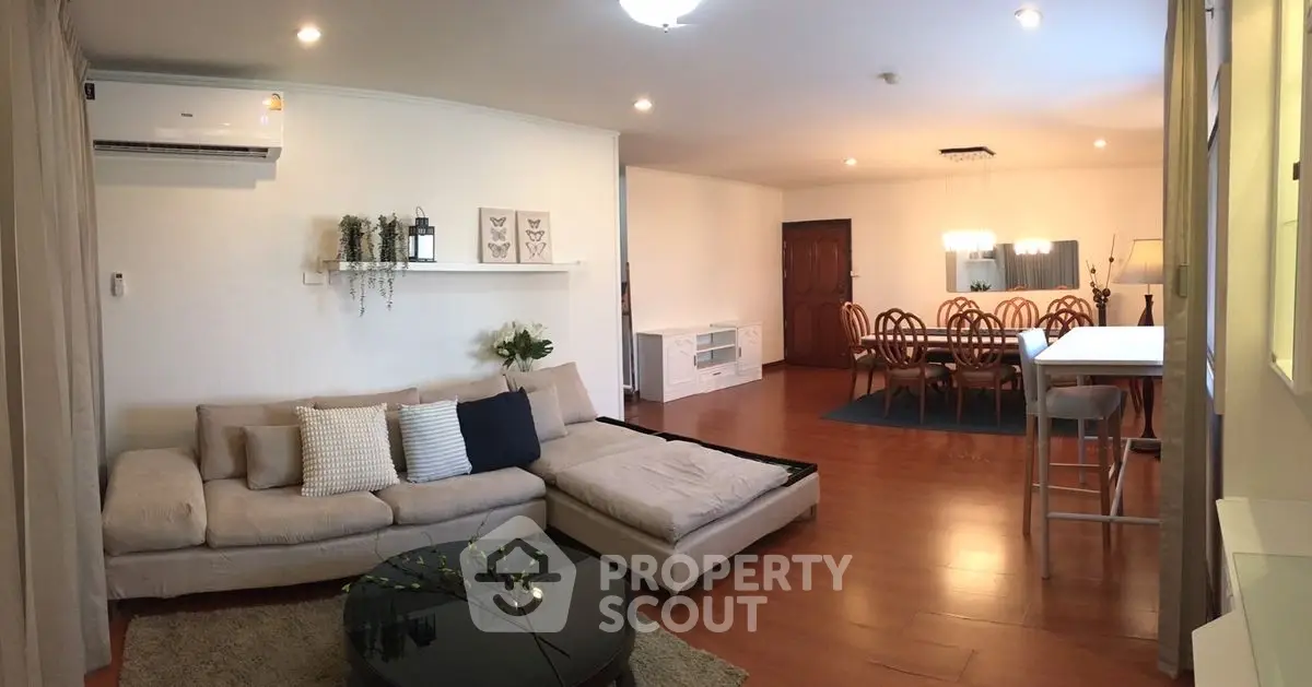 Spacious living room with elegant dining area and modern decor