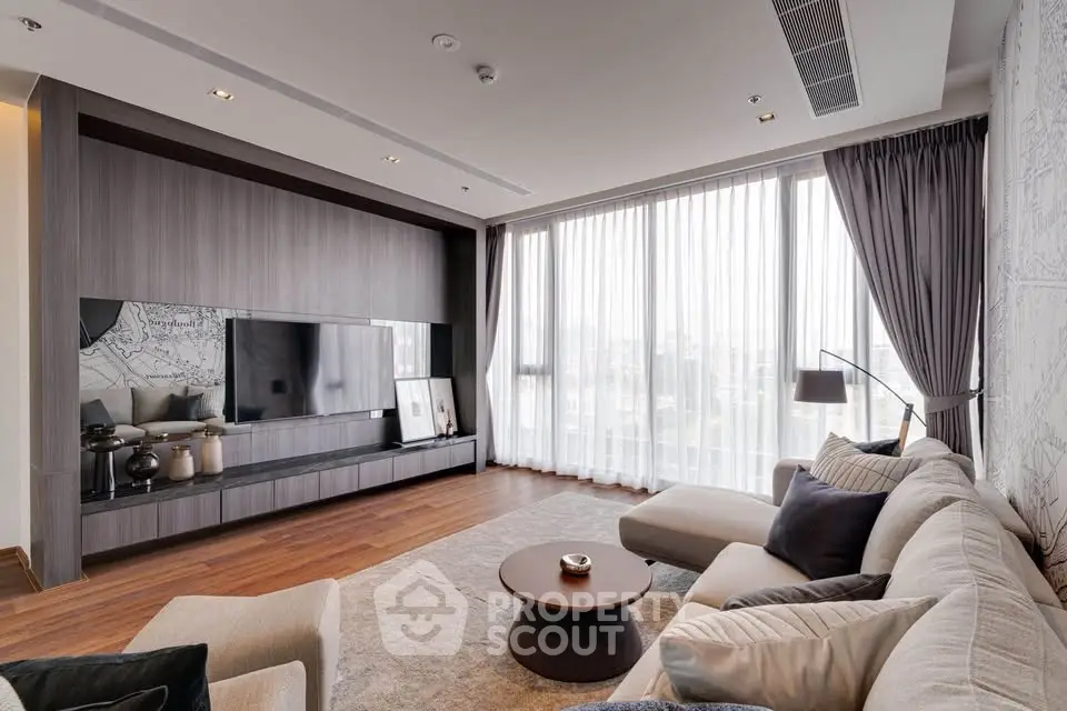 Luxurious modern living room with floor-to-ceiling windows and elegant decor