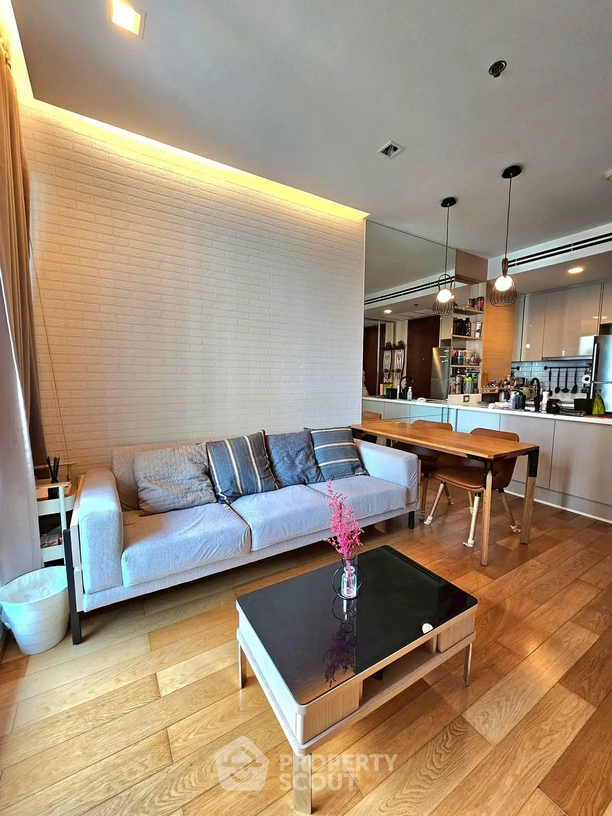 Modern living room with stylish decor and open kitchen layout