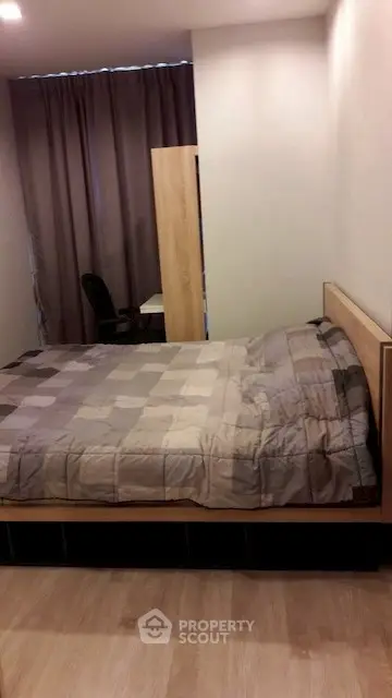 Cozy bedroom with modern decor and comfortable bed in a stylish apartment.
