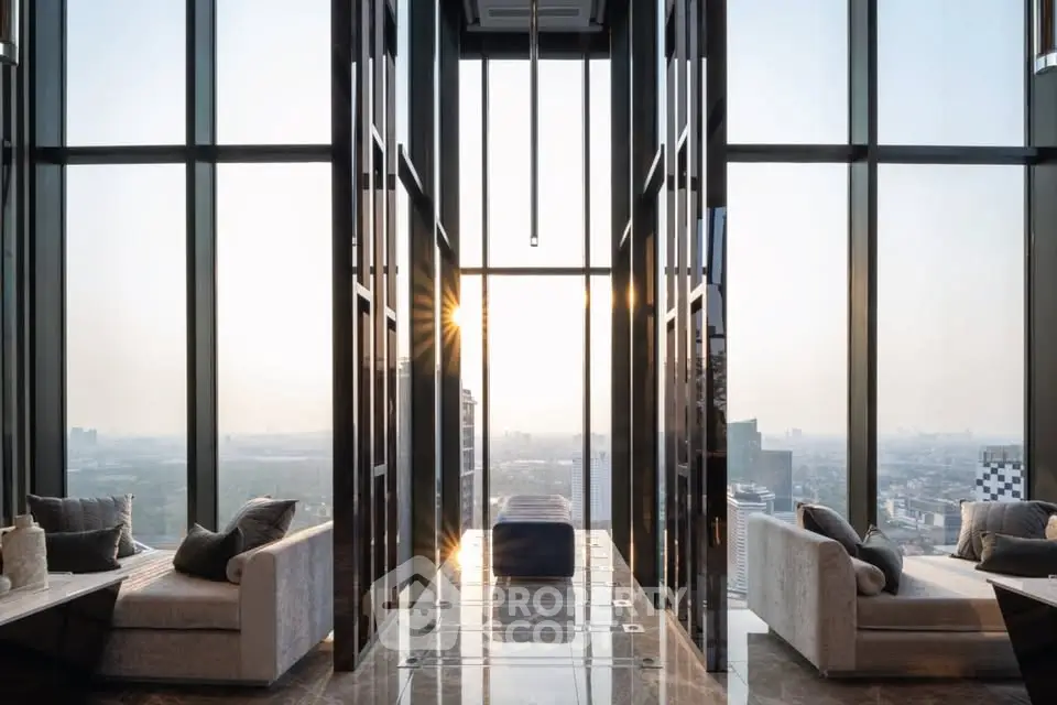 Luxurious high-rise living room with panoramic city views and elegant modern design.