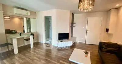 Spacious modern living room with elegant chandelier and stylish decor