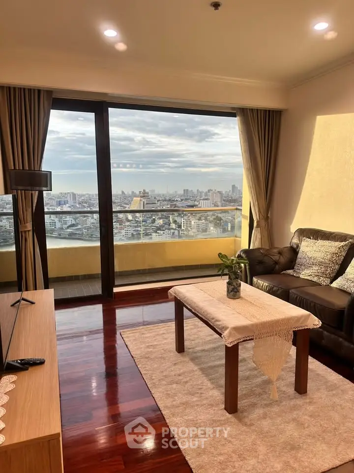 Spacious living room with stunning city view and elegant decor