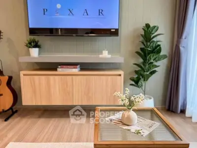 Stylish living room with modern decor, wall-mounted TV, and elegant wooden furniture.
