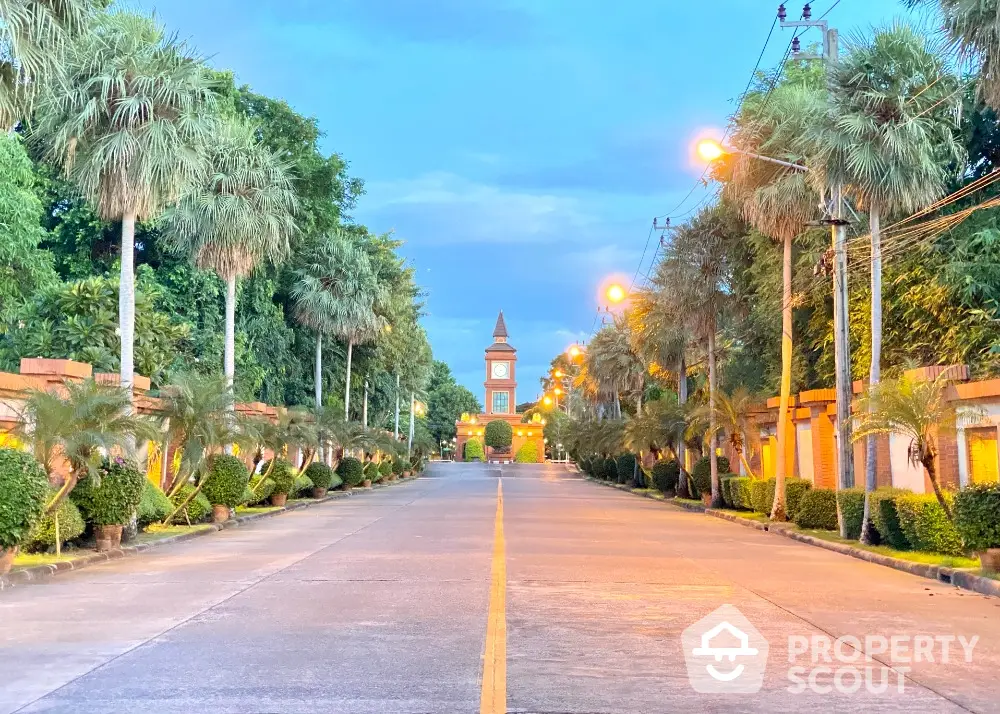 Stunning entrance view with lush greenery and elegant clock tower