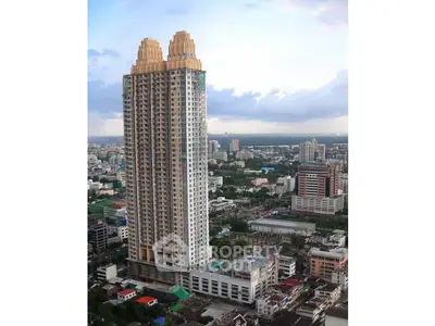 Stunning high-rise building with unique architectural design in vibrant cityscape.