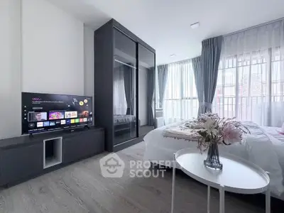 Modern bedroom with sleek design, large windows, and stylish decor