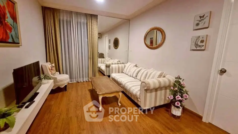 Charming living room with elegant decor and cozy seating, perfect for relaxation and entertainment.