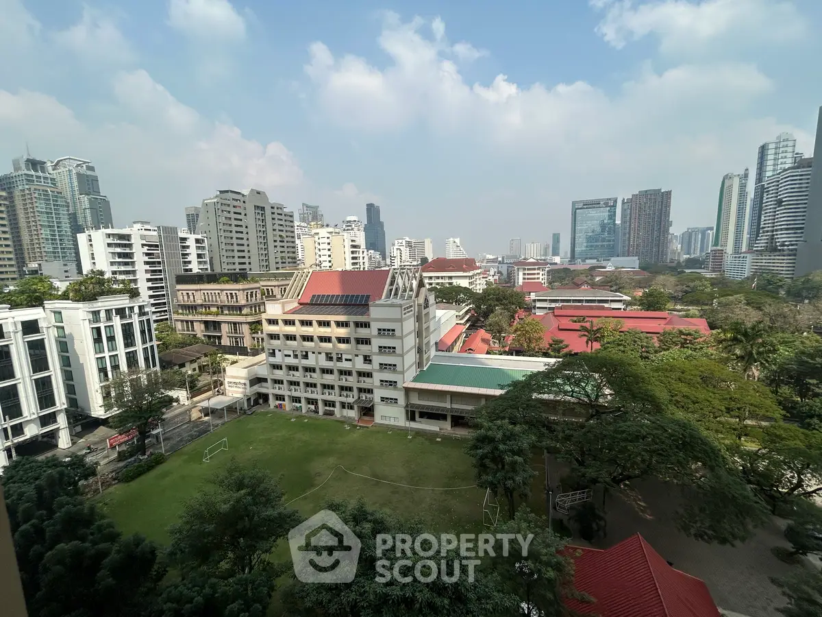 Stunning cityscape view with lush greenery and modern buildings, perfect for urban living.