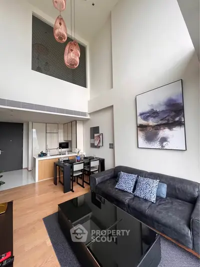 Modern living room with high ceiling and stylish decor